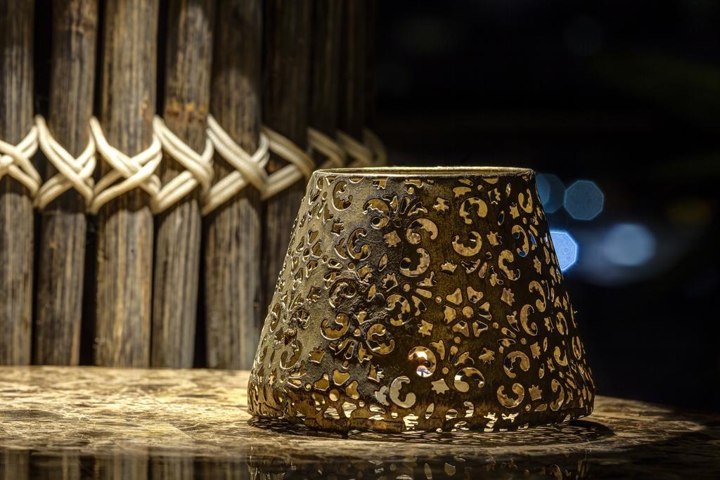 Ghl Hotel Monteria Exterior photo A candle holder